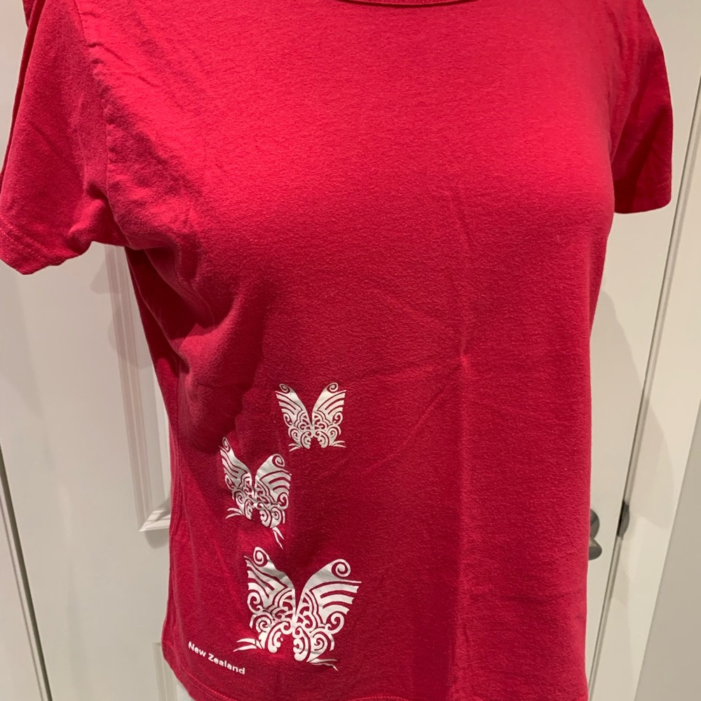 Red T-shirt,  print on front of NZ Maori faces